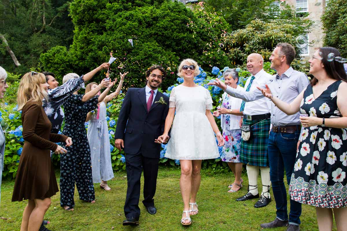 Bride and groom confetti line at Old Kilmun House. Scotland wedding photographer. Dunoon wedding photography.